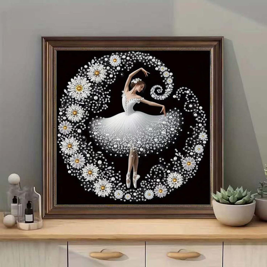 Diamond painting kit featuring a ballerina surrounded by flowers and crystals on a black background, framed.