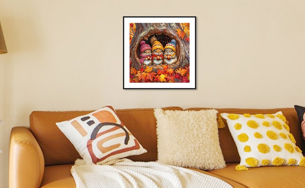 Framed 5D squirrel diamond painting kit artwork hanging on a wall above a sofa with decorative pillows.