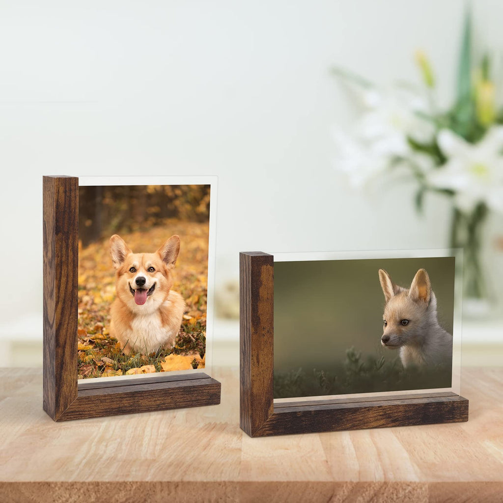 Set of two wooden picture frames displaying photos of a corgi and a fox cub on a wooden surface.