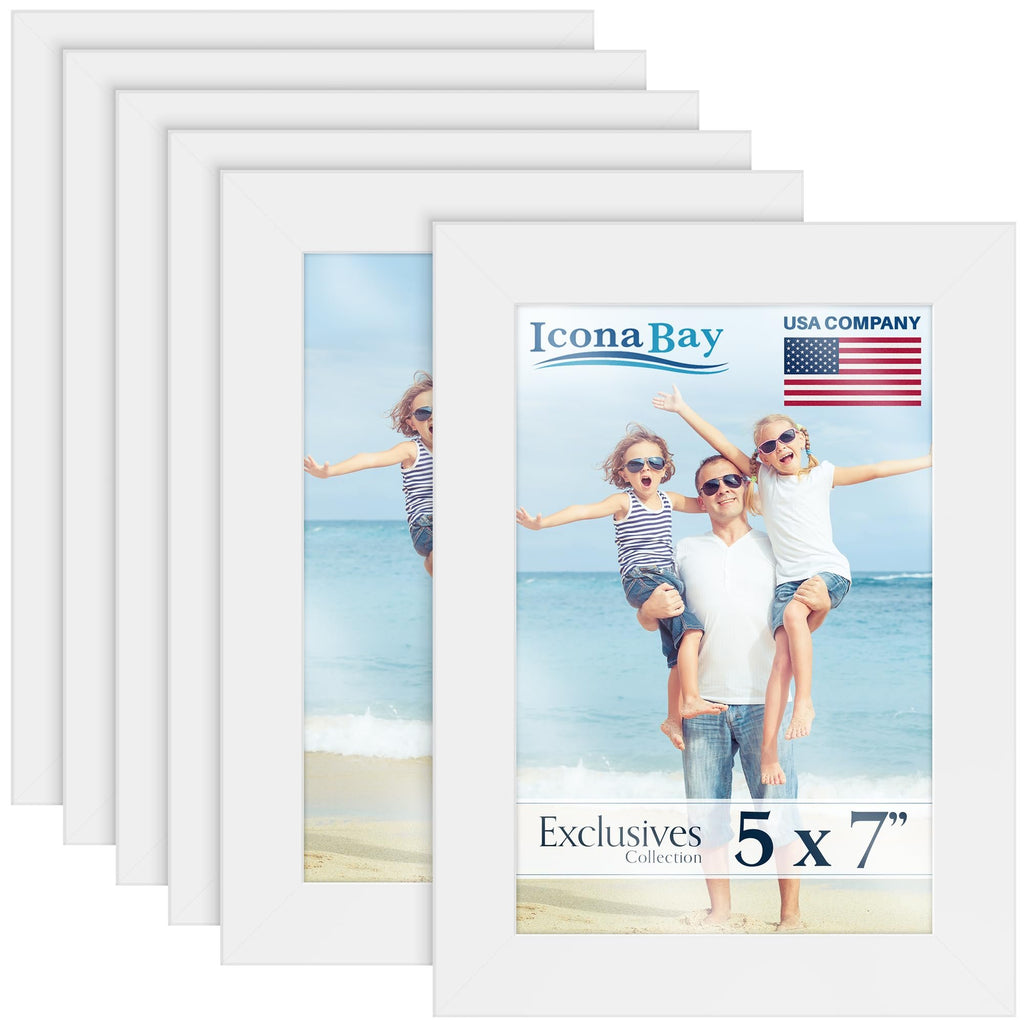 Six white 5x7 picture frames stacked, one showing a family on a beach.