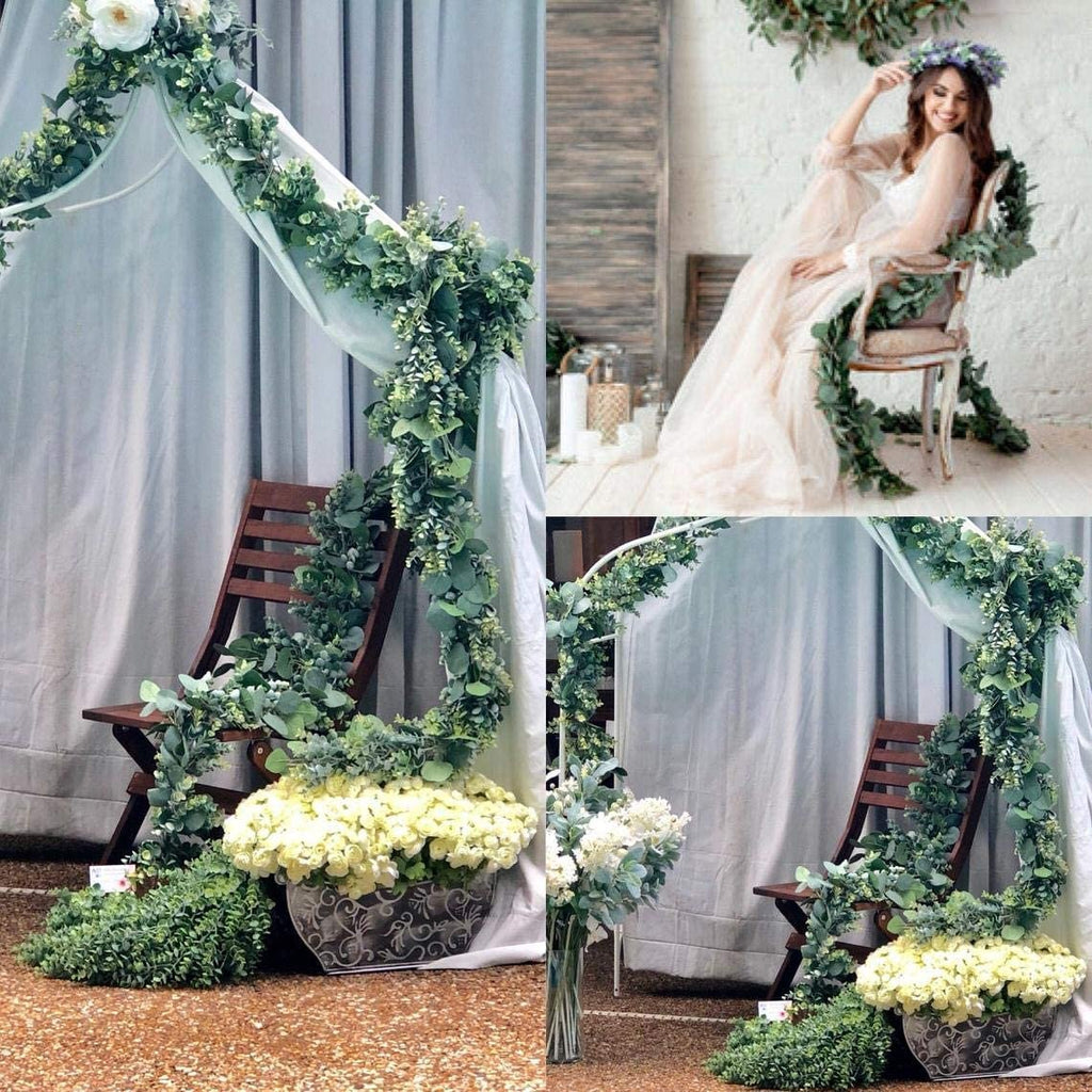 Artificial eucalyptus garland with lambs ear and magnolia leaves draped on a wedding arch and chair, with a woman in a dress sitting on the chair.