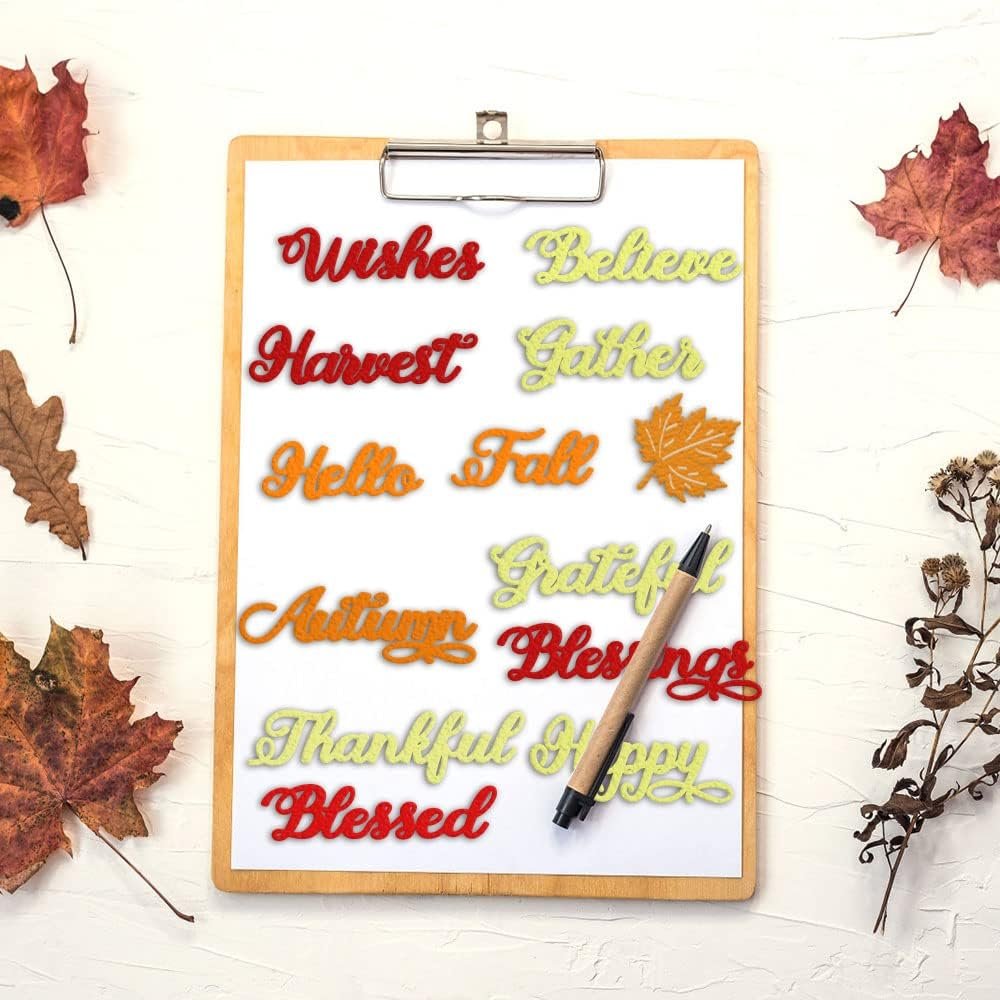 Fall words cutting die set with autumn letters and maple leaf shapes on a clipboard
