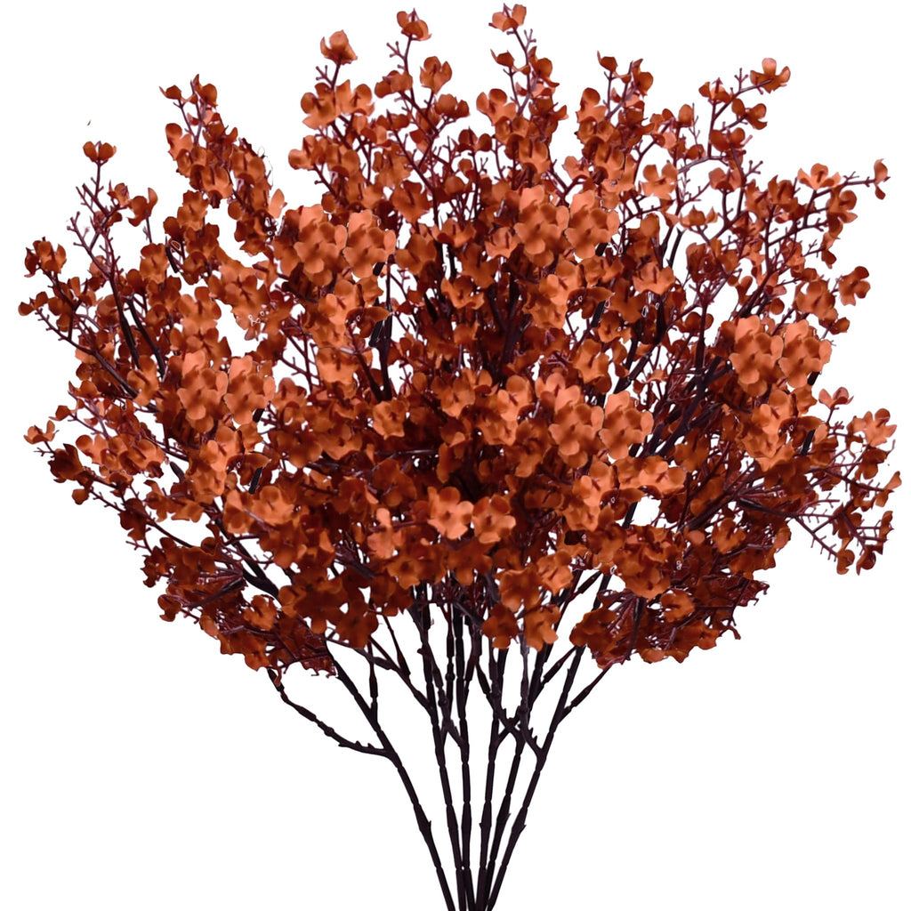 Burnt orange artificial baby's breath flower bush on a white background, showing multiple stems with small blossoms.