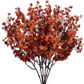 Burnt orange artificial baby's breath flower bush on a white background, showing multiple stems with small blossoms.