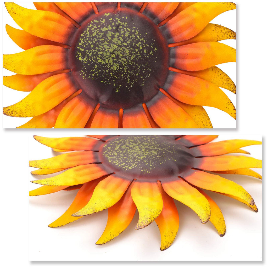 Close-up of a hand-painted metal sunflower wall art with orange and yellow petals and a dark center with green speckles.