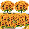 Six bunches of artificial sunflowers with green leaves, displayed against a white and yellow background.
