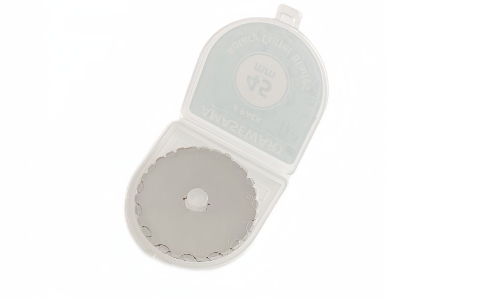 Crochet edge rotary cutter blade in a clear plastic storage case, showing the scalloped edge of the blade.