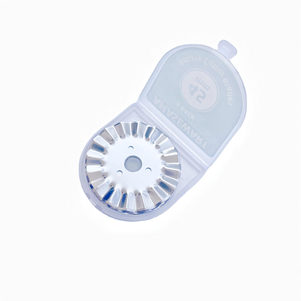 Pinking rotary cutter blade with wave edge inside a clear storage case, top-down view.