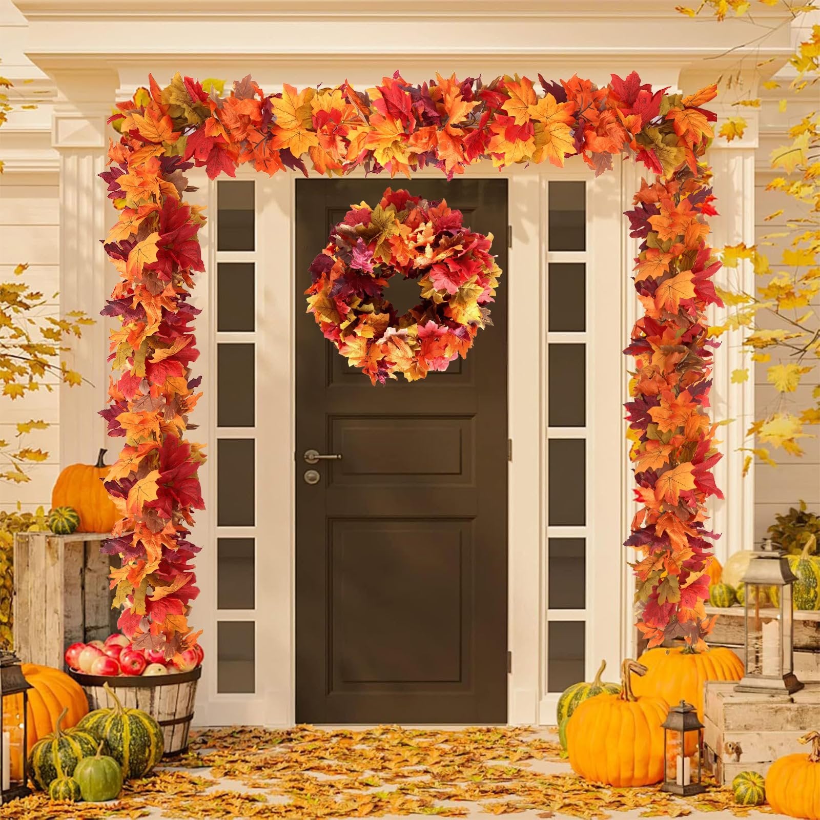 Autumn maple leaf garland and wreath decorating a front door with pumpkins and apples