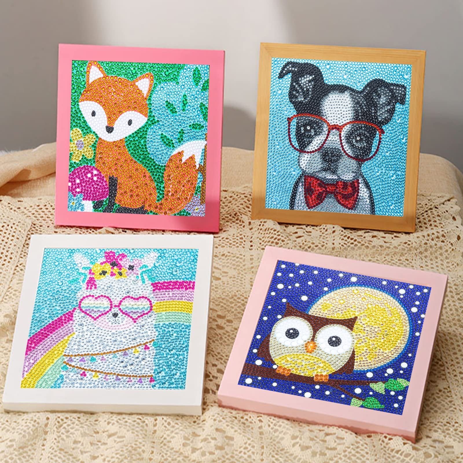 Four framed 5D diamond painting kits featuring a fox, a dog with glasses, a unicorn, and an owl under the moon.