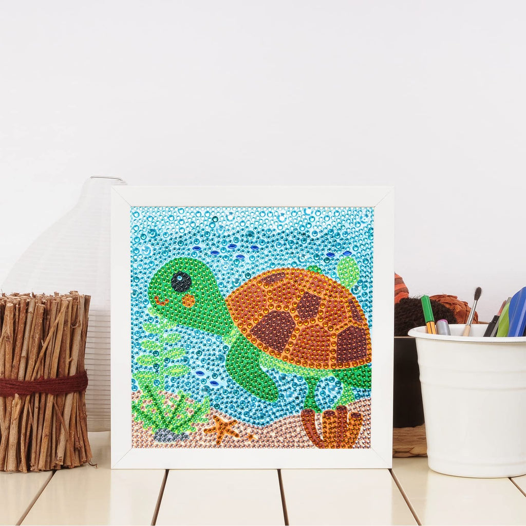 Framed diamond painting kit of a cute sea turtle swimming underwater with starfish and seaweed.