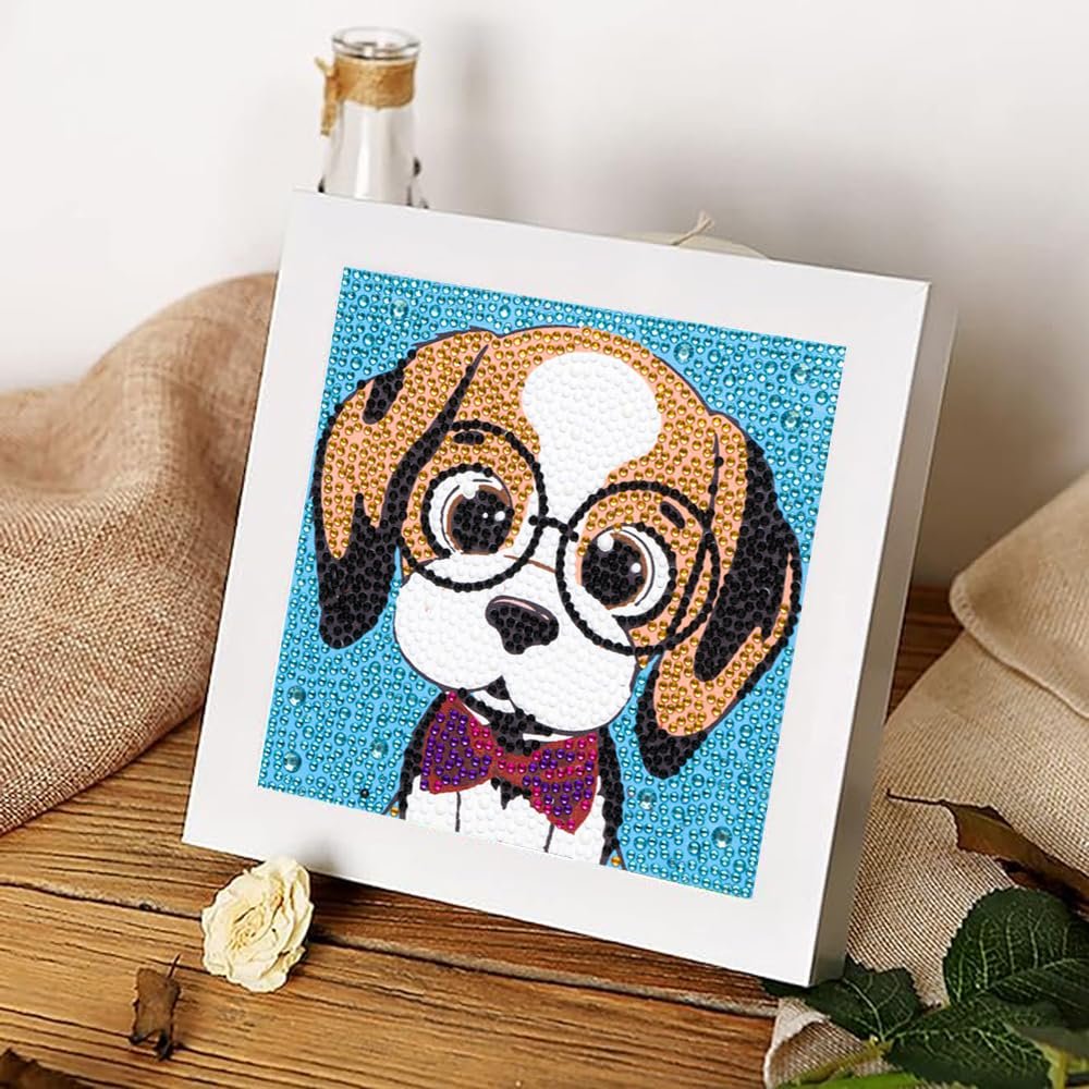 Diamond painting kit of a cute dog wearing glasses and a bow tie, displayed on a wooden table.