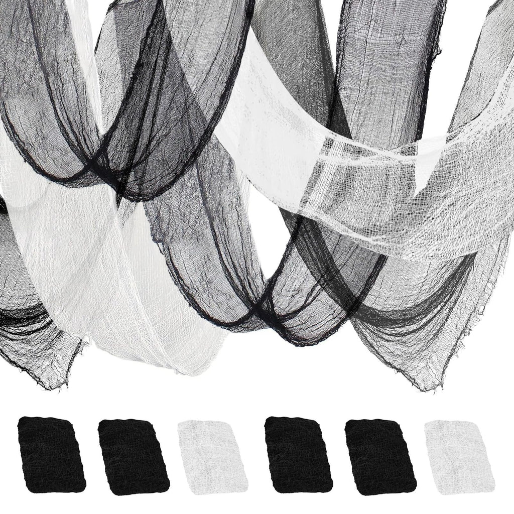 Black and white creepy cloth gauze draped and folded, with swatches of black and white fabric below on a white background.