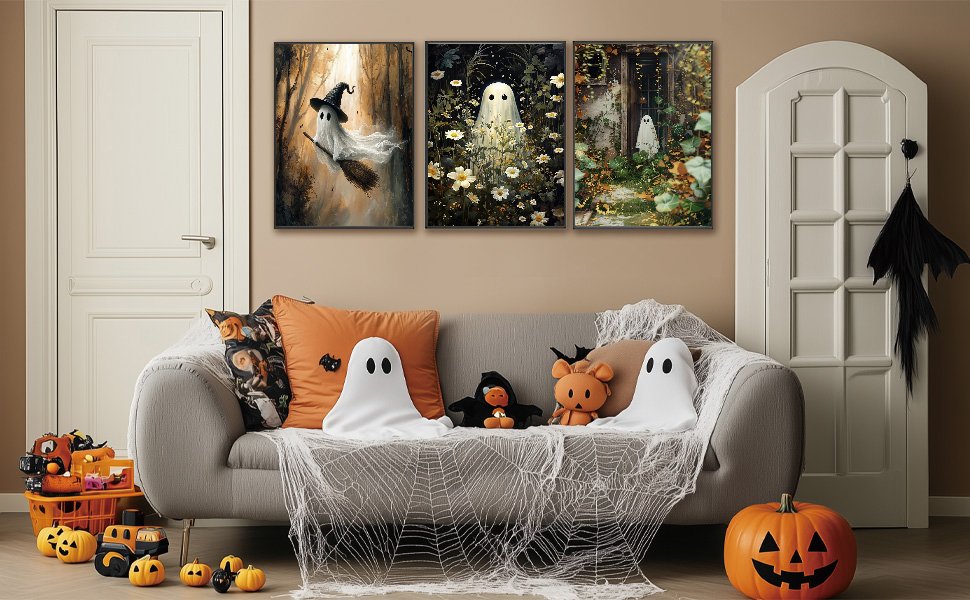 Halloween ghost diamond art paintings displayed above a couch decorated with spiderwebs and pillows