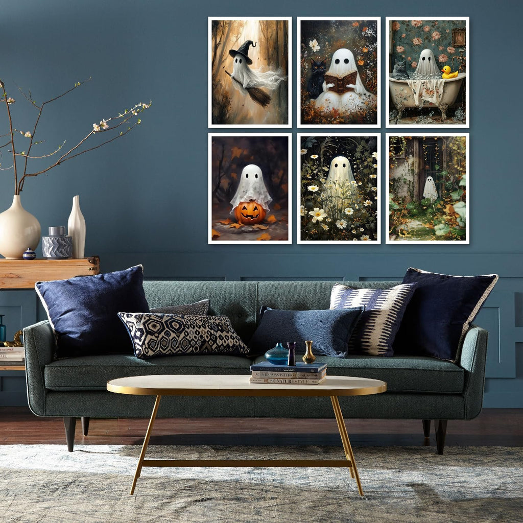 Six framed Halloween ghost diamond art paintings displayed on a wall above a sofa.