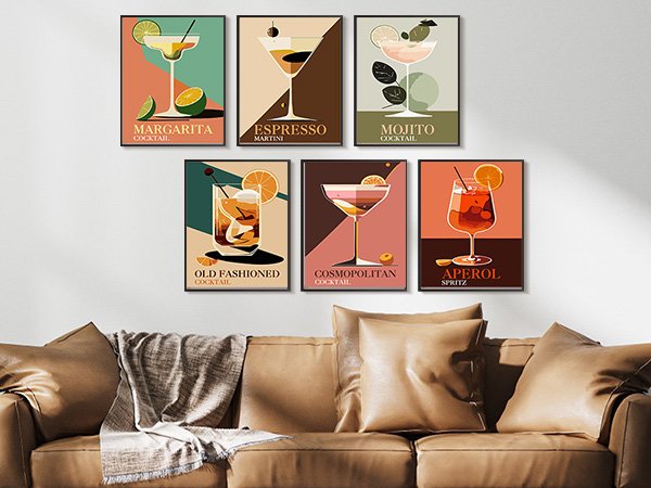 Six framed cocktail art prints displayed on a wall above a leather sofa.