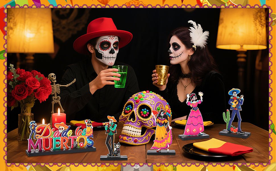 Day of the Dead table decor set with calavera figures and 'Dia de los Muertos' sign, featuring people in costume.