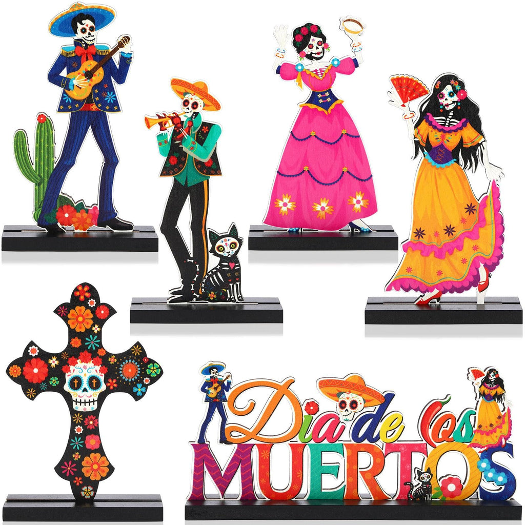 Day of the Dead wooden centerpiece set with figures, a cross, and text.