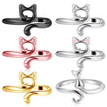 Four adjustable metal cat-shaped rings in black, silver, rose gold, and gold finishes on a white background.