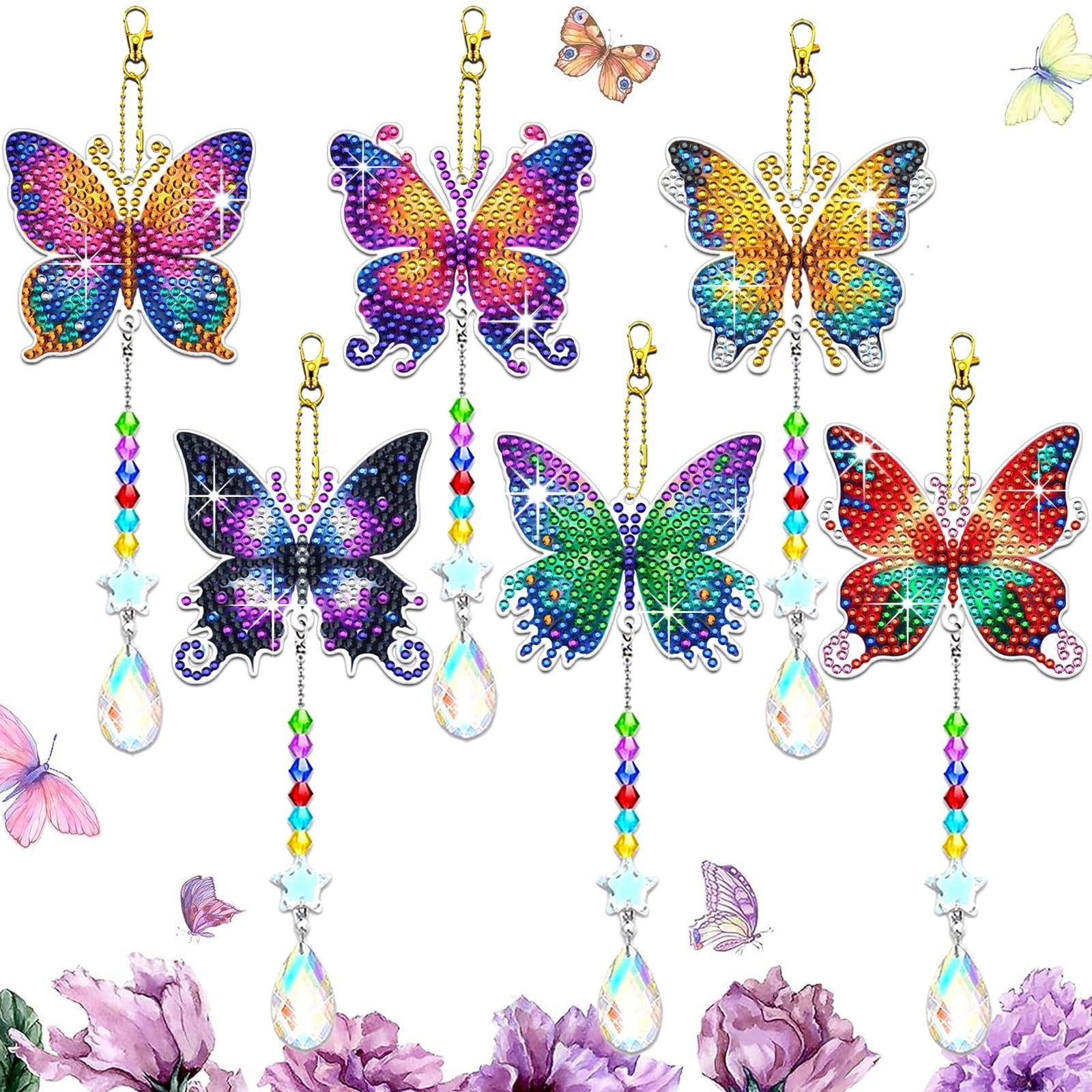 Six diamond art butterfly suncatcher wind chimes with crystal drops and colorful beads hanging against a white background with floral accents.