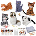 Collection of seven needle-felted cats and felting supplies including wool, needles, and tools.