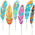 Six diamond painting feather bookmarks with crystal pendants, displayed against a white background.