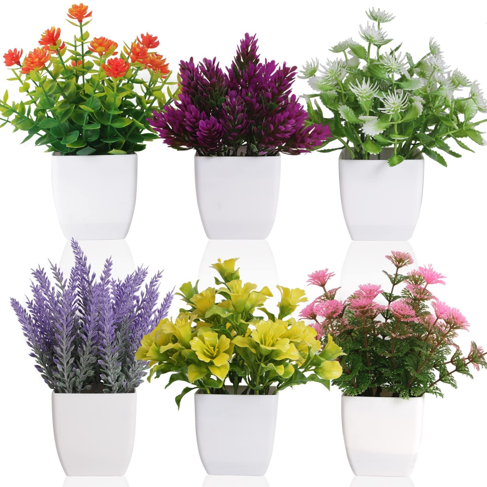 Six artificial potted plants in white square pots, arranged in two rows of three, featuring orange, purple, white, lavender, yellow, and pink flowers.