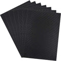 Six pieces of black Aida cloth fanned out against a white background, showing the woven texture.