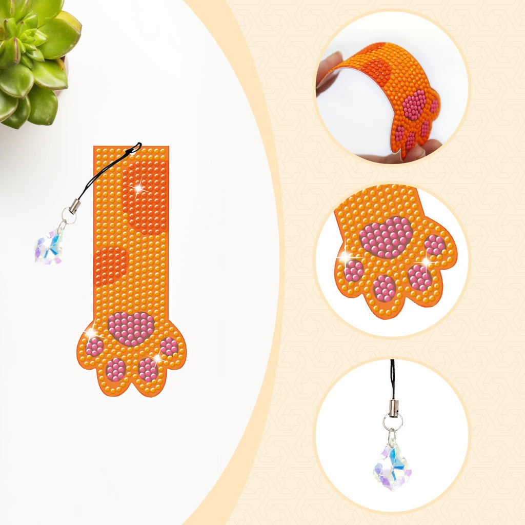 Diamond painting cat paw bookmark with crystal pendant, shown from multiple angles and with a succulent plant.