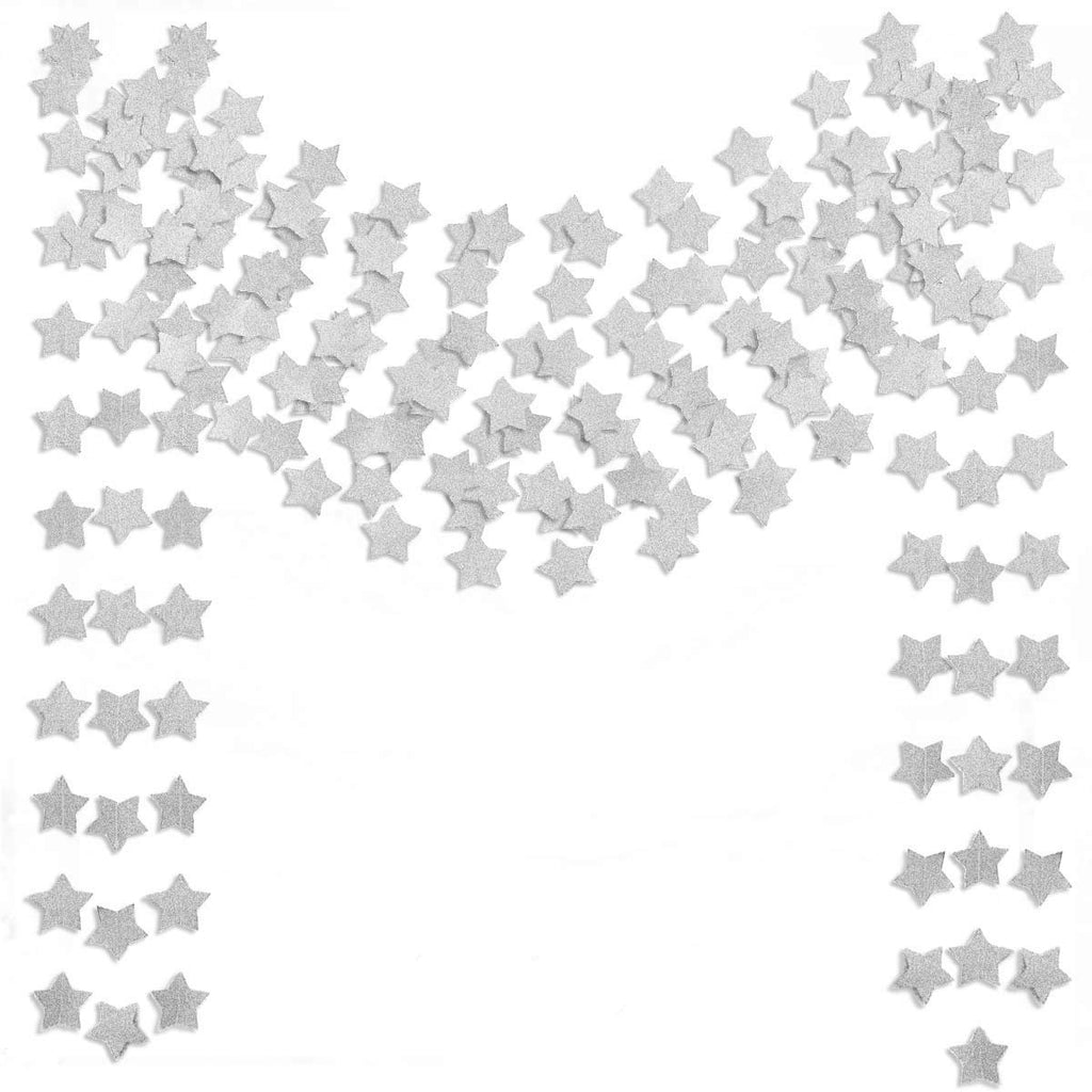 Scattered silver glitter star cutouts on a white background, arranged in arcs and columns.