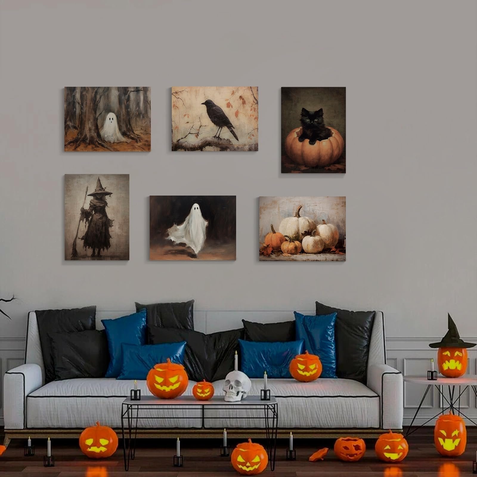 Six vintage Halloween canvas art prints displayed above a sofa with pumpkins and a skull.
