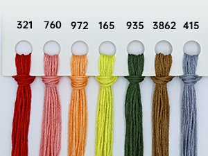 Embroidery floss organized by color with numerical labels above each strand.