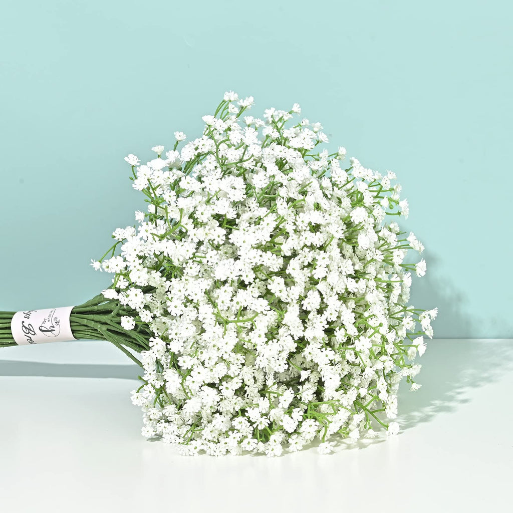 Bouquet of 6 stems of white artificial baby's breath flowers tied with a pink band