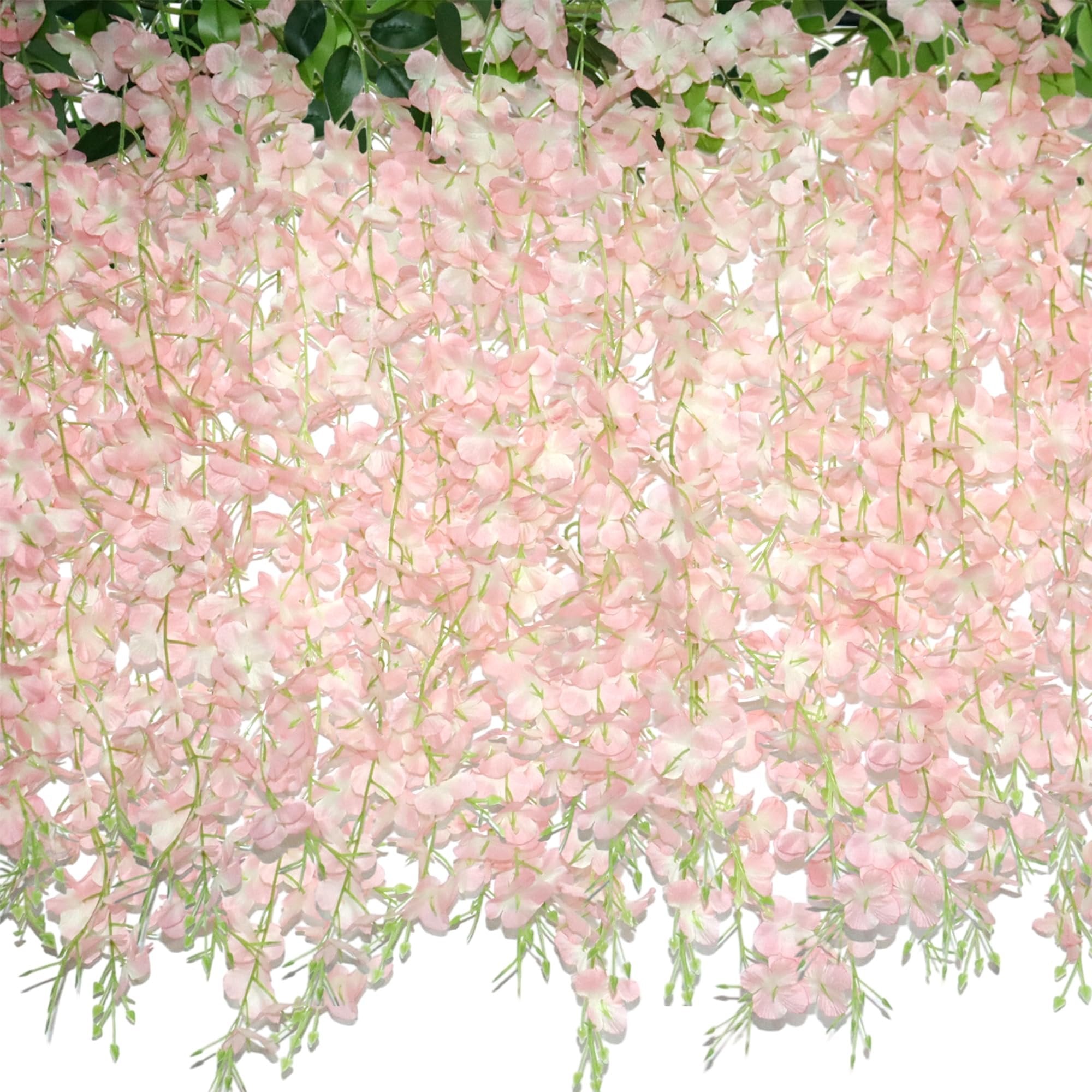 Close-up of cascading pink artificial wisteria garland with green leaves against a white background.