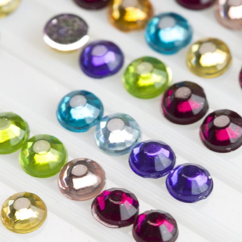 Assorted colorful round flatback rhinestones for diamond painting, arranged in rows on a white tray.
