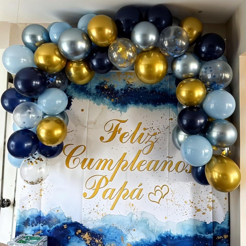 Balloon arch with navy blue, gold, silver, and light blue balloons framing a banner that says Feliz Cumpleaños Papá
