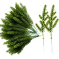 Artificial pine needle picks with green plastic branches on white background, close-up view