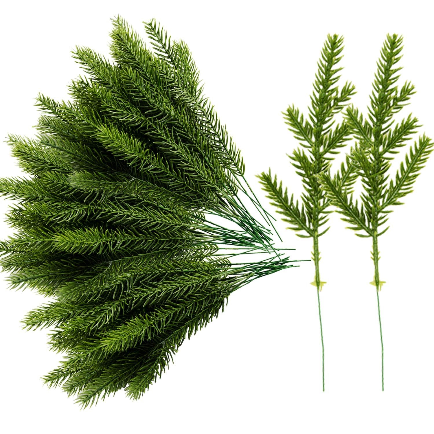Artificial pine needle picks with green plastic branches on white background, close-up view