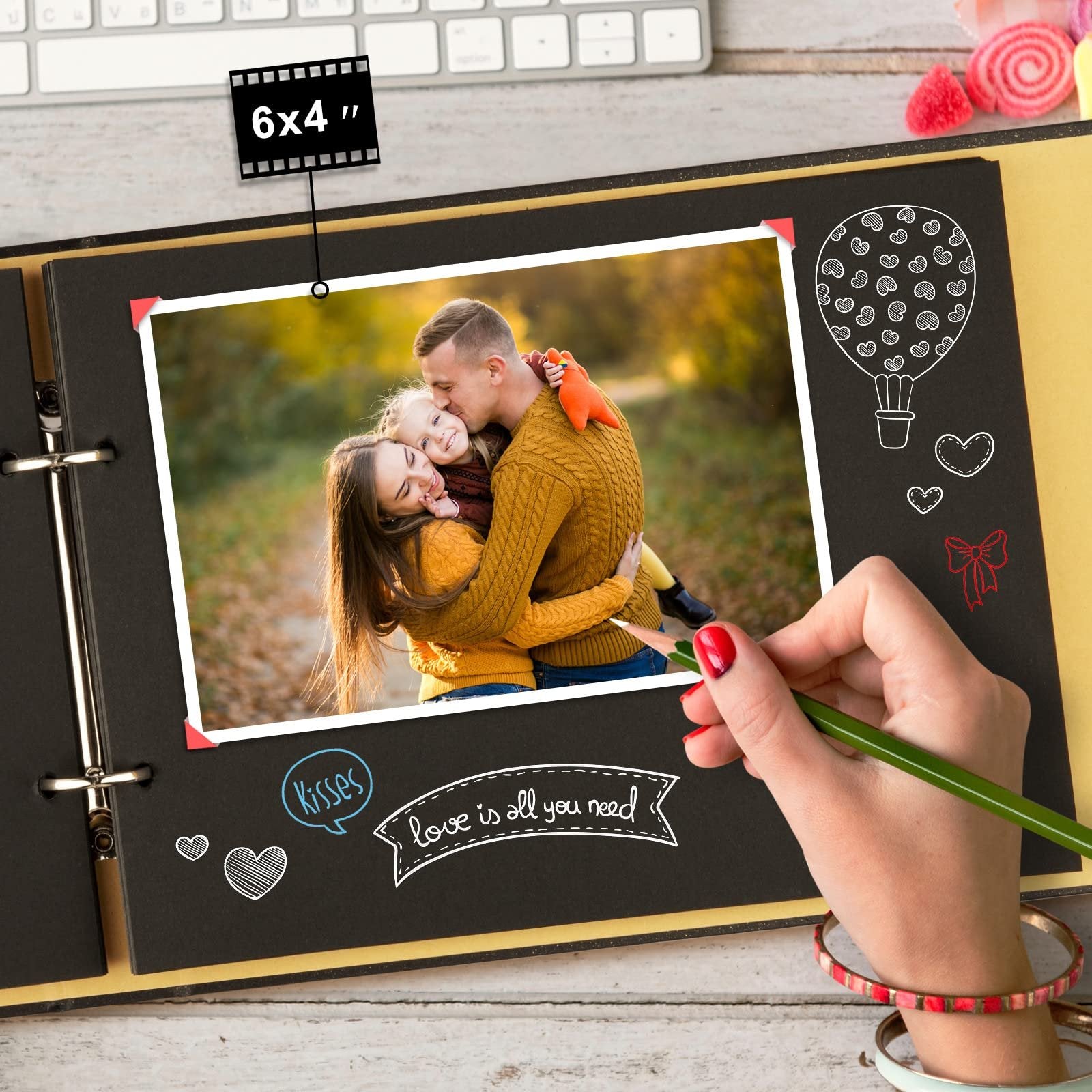 DIY scrapbook page with a family photo, chalk-style drawings of a hot air balloon and hearts, and text overlays.