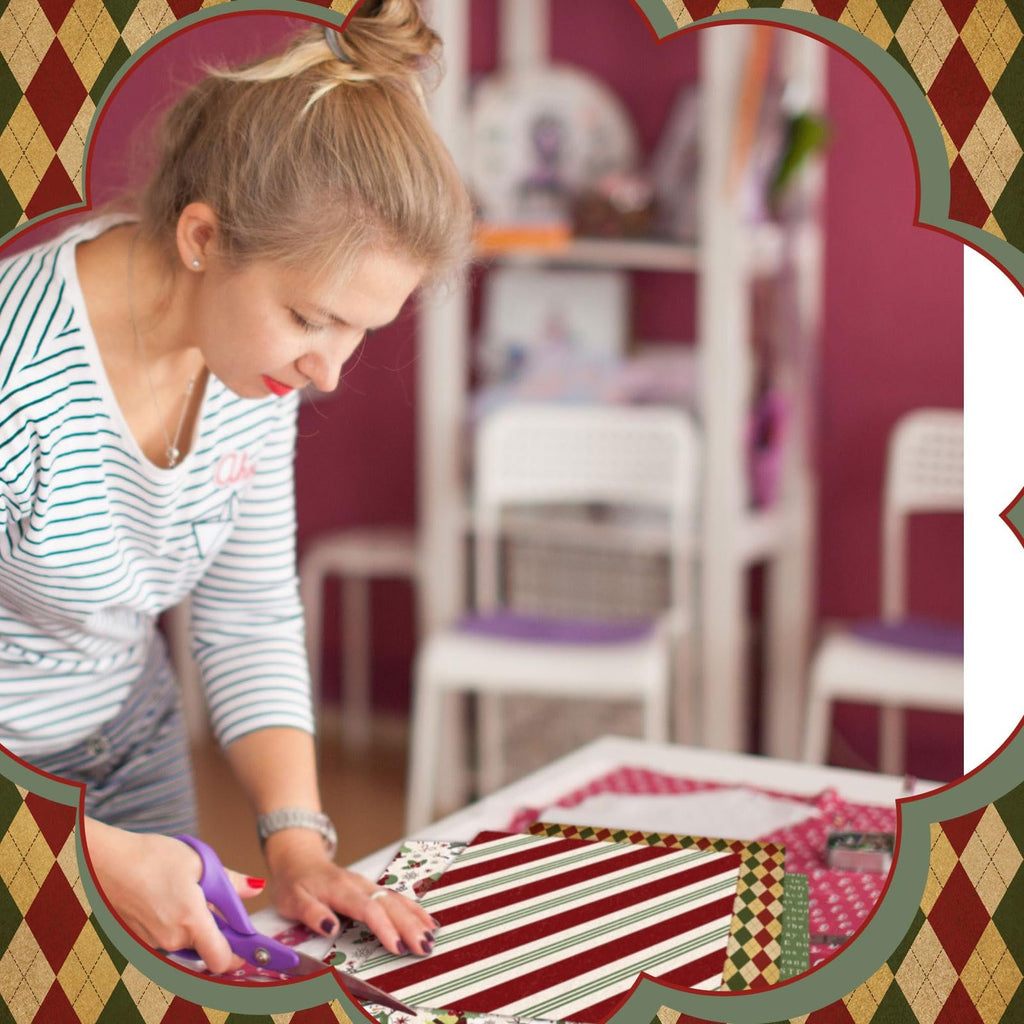 Woman cutting Christmas fabric squares with scissors at a table, surrounded by a decorative border.