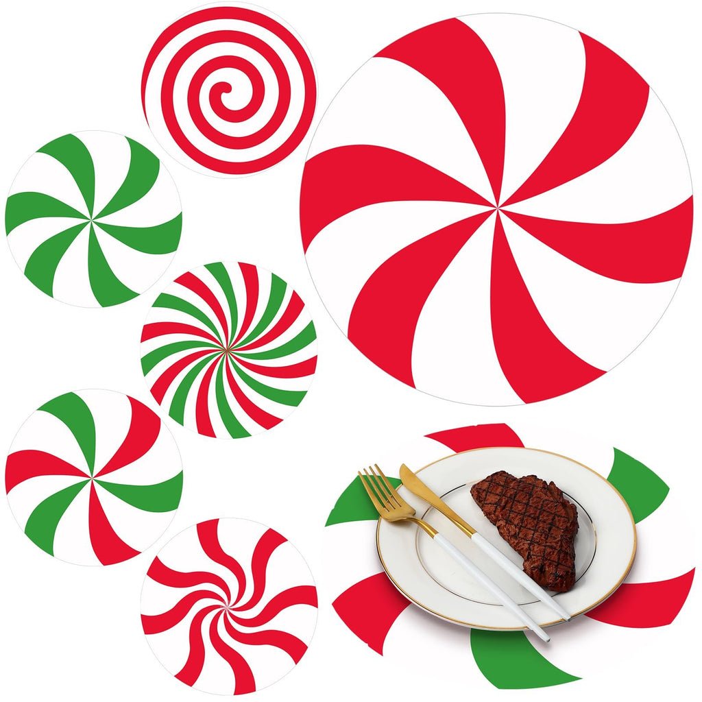 Christmas candy paper round placemats in red and green swirls and stripes, one shown under a plate with steak and cutlery