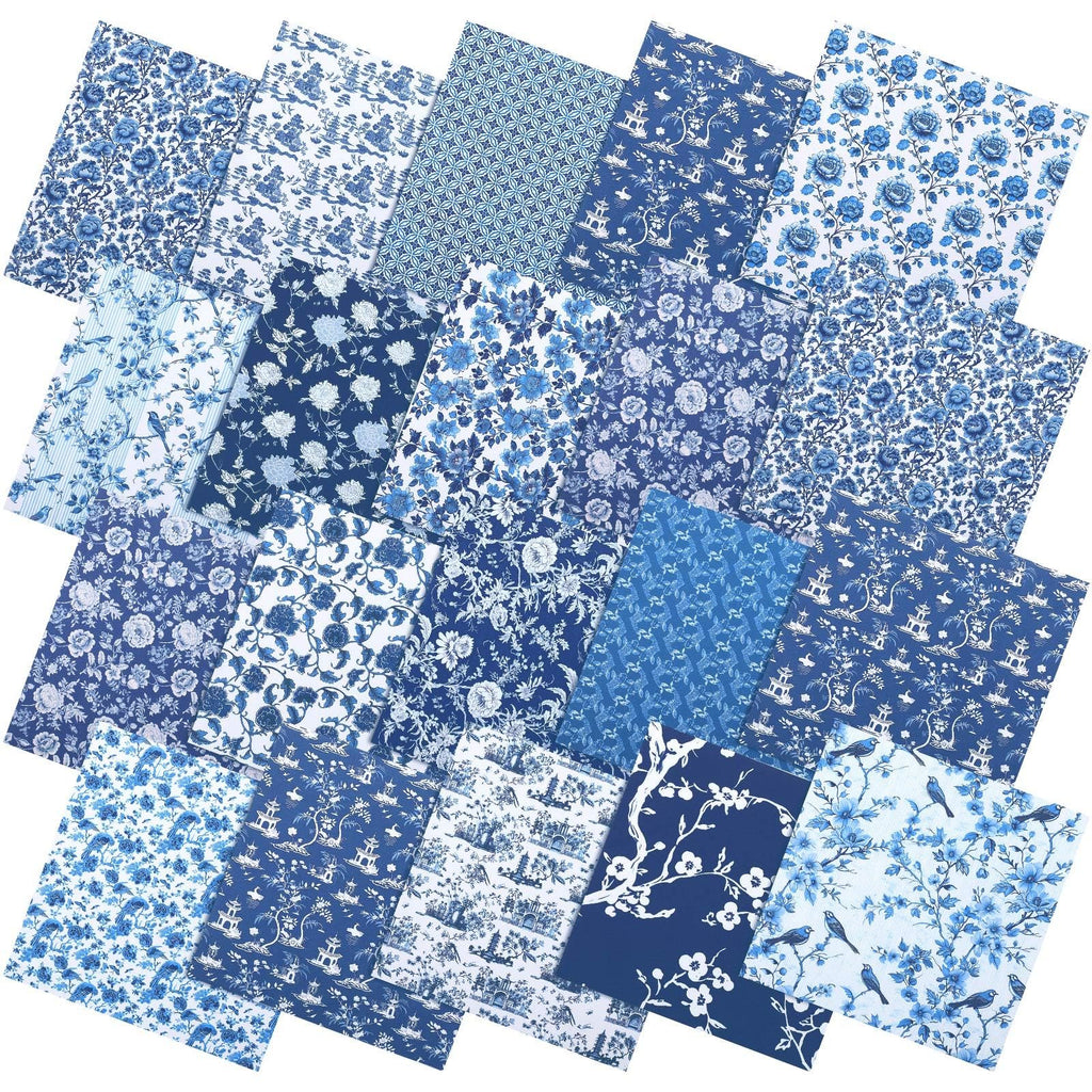 Collection of blue and white chinoiserie fabric squares with floral and bird patterns, fanned out.