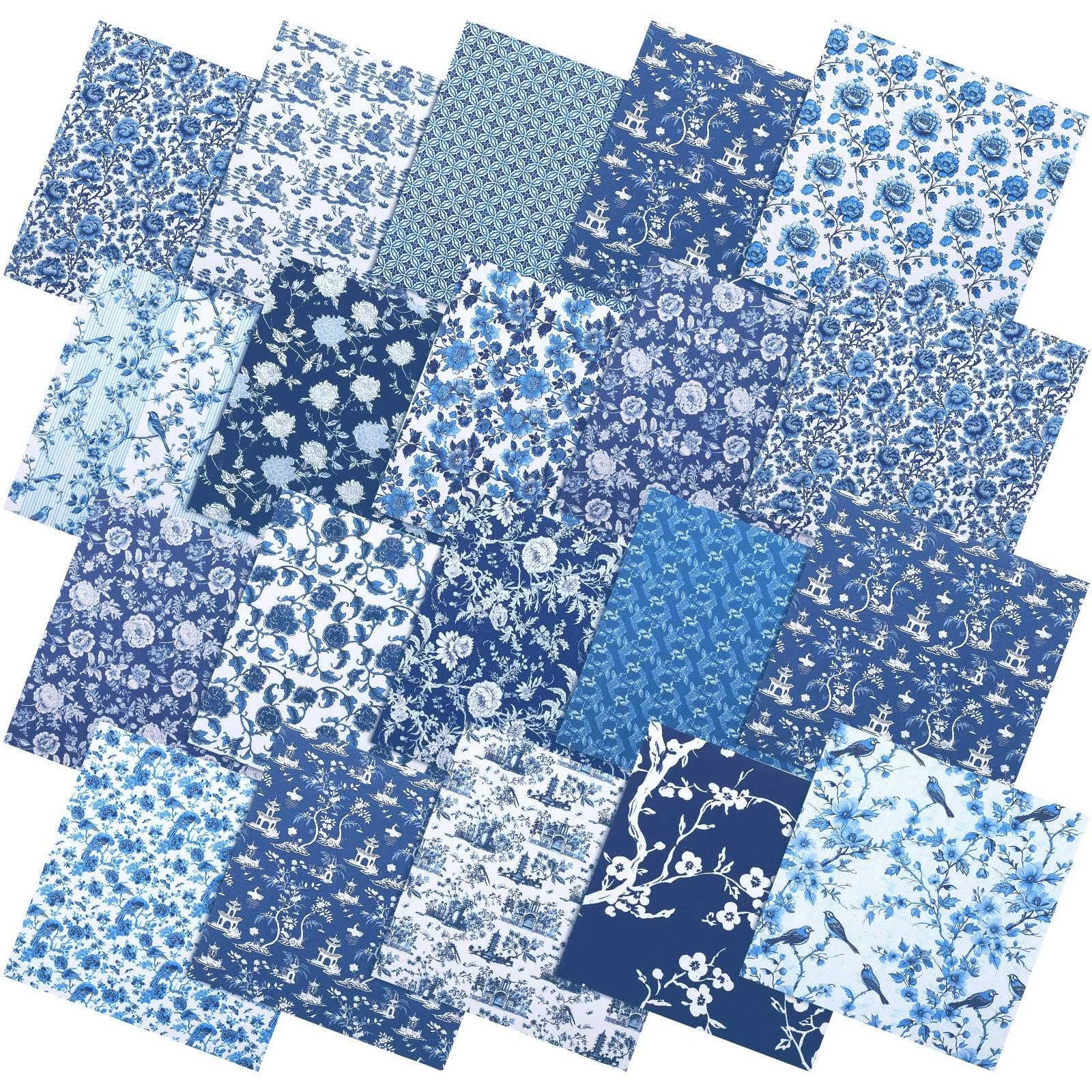 Collection of blue and white chinoiserie fabric squares with floral and bird patterns, fanned out.