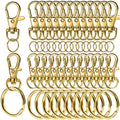 Gold swivel snap hooks and key rings arranged in rows on a white background.