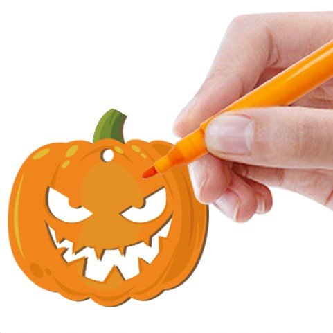 Halloween pumpkin ornament being colored with an orange marker by a hand