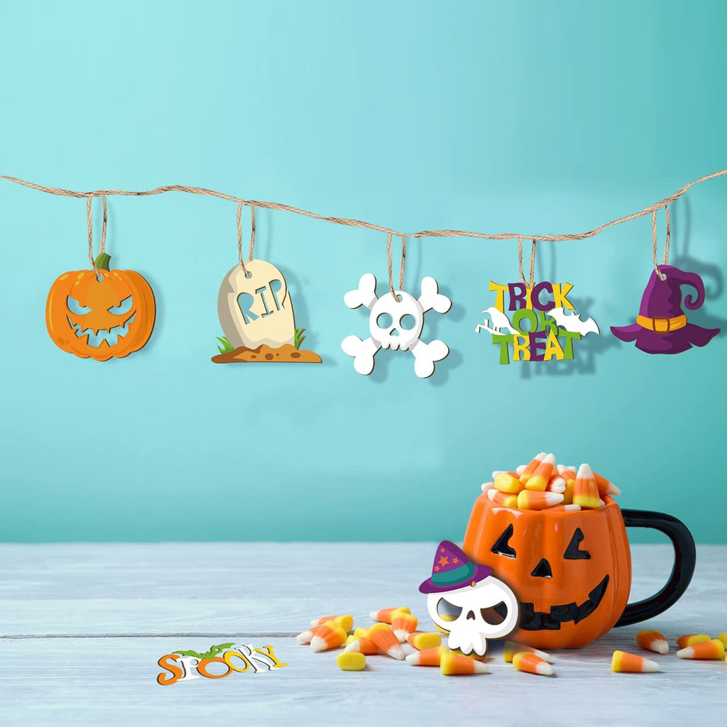 Halloween decorations including a pumpkin, tombstone, skull, witch hat, and 'Trick or Treat' sign hanging on a string, with a pumpkin mug filled with candy corn and scattered candy corn on a table.