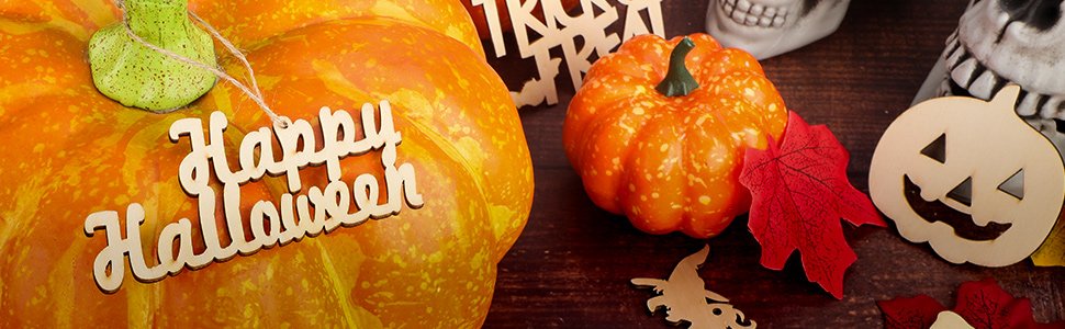 Halloween pumpkins and wooden cutouts including a 'Happy Halloween' sign and jack-o-lanterns