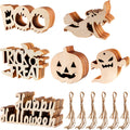 Halloween wooden ornament slices with twine, featuring "BOO", "TRICK OR TREAT", pumpkin, ghost, and "Happy Halloween" text.