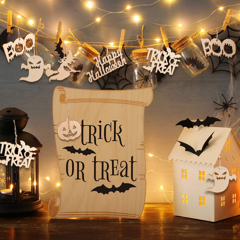 Halloween decorations including wooden ornaments with 'Trick or Treat' and 'Happy Halloween' text, hanging on string lights.