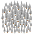 Collection of 60 silver glitter bottle brush mini Christmas trees in four sizes, each on a wooden base, arranged on a white background.